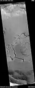 Surface fractured into mesas, as seen by HiRISE under HiWish program.  Some of the mesas appear to have moved apart and rotated.