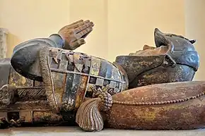 Tomb of Philippe Pot (d. 1493) with amour and a heraldry shield.