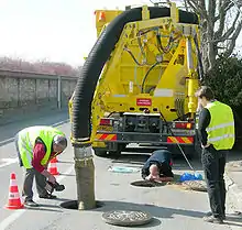 Cleaning out a sewer manhole