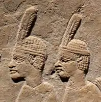 Nubian prisoners.They wear the typical one-feathered headgear of Taharqa's soldiers.