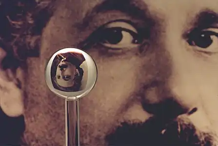 An image of one of the most accurate human-made spheres, as it refracts the image of Einstein in the background. This sphere was a fused quartz gyroscope for the Gravity Probe B experiment, and differs in shape from a perfect sphere by no more than 40 atoms (less than 10 nm) of thickness. It was announced on 1 July 2008 that Australian scientists had created even more nearly perfect spheres, accurate to 0.3 nm, as part of an international hunt to find a new global standard kilogram.