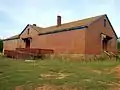 The Eleanor Roosevelt School in Warm Springs was built in 1936 and opened in 1937. It was the last Rosenwald school built in the United States using funds provided by the Julius Rosenwald Fund. The school operated from 1937 until 1972. The building was purchased privately in 1977. It was added to the National Register of Historic Places on May 3, 2010.