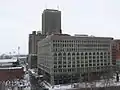 Seneca One Tower (then named One HSBC Center) behind Ellicott Square Building