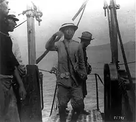 Surrendered President Aguinaldo boards the USS Vicksburg, 1900.