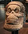 Monumental stone carving of a skull from Mesoamerica