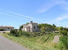 The church and surroundings in Étriac