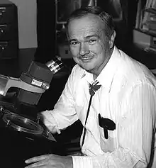 Eugene Shoemaker at a stereoscopic microscope