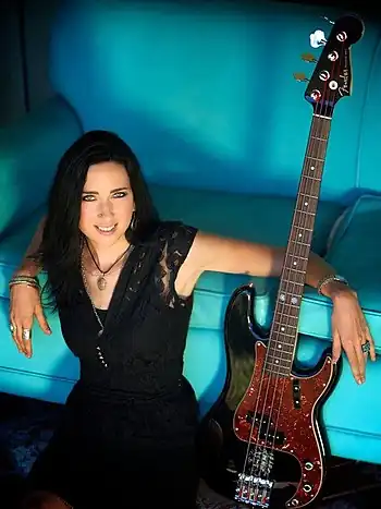 Gardner with her signature Fender Precision bass in 2013