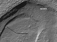 Crater that was buried in another age and is now being exposed by erosion, as seen by the Mars Global Surveyor, under the MOC Public Targeting Program.