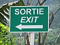 An exit sign in Mauritius in French and English