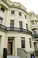 The Exterior of 13 Brunswick Square. The early glass was fragile and storm shutters protected the glass from stones blown up during storms.