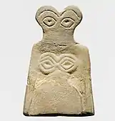 Eye idol; 3700–3500 BC; gypsum alabaster; 6.5 × 4.2 × 0.6 cm; Metropolitan Museum of Art