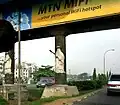 Bridge pillars in Lagos showing Eyo figures