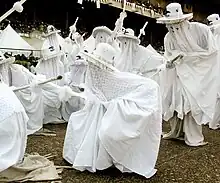 Eyo Olokun masquerades at the TBS. Eyo Olokun are connected with Olokun, the Yoruba deity of the sea.