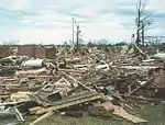 Brick homes get reduced to piles of rubble. Above-ground structures are almost completely vulnerable to F4 tornadoes, which level well-built structures, toss heavy vehicles through the air, and uproot trees, turning them into flying missiles.