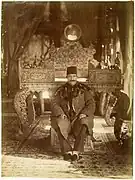 Naser al-Din Shah along with the Sun Throne at the Mirror Hall