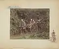 Jinriki, 1886. Hand-coloured albumen print on a decorated album page. A rickshaw driver, two passengers and a bearer.