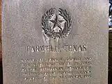 Monument in Farwell, Texas, noting the Farwell brothers as receiving the land which became the XIT in exchange for constructing the Texas State Capitol building