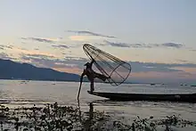 Fisherman about to drop his net