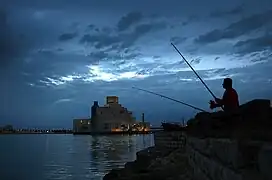 Fisherman on the next to the Islamic Museum