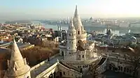 Fisherman's Bastion at the Castle Hill of old Budapest (Buda). Part of the fortification, city centre in the background