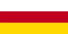 The flag of Ossetia, a simple horizontal triband.