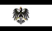 The flag of Prussia (1892–1918), a charged horizontal triband.