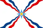 The Assyrian flag without the image of Assur. This version has been used by the Nineveh Plain Protection Units.