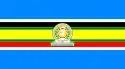 Nine horizontal strips coloured (from top to bottom): blue, white, black, green, yellow, green, red, white, then blue. The emblem of the EAC is placed in the centre.