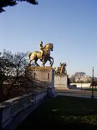 looking north at statues of horses on pedestals