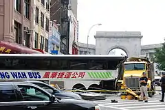 Front of a bus, struck by a dump truck