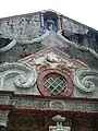 Details of window and pediment with a niche for a statue of Saint John the Baptist