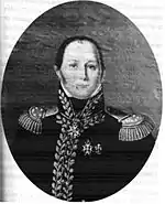 Black and white print shows a clean-shaven man in an elaborate dark military uniform with a high collar, epaulettes and lots of gold braid.