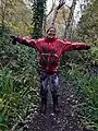 Muddy volunteer after a morning's work in wet woodland