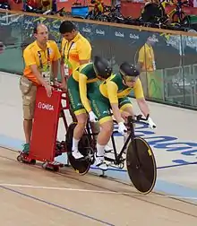 two women on a tandem bicycle