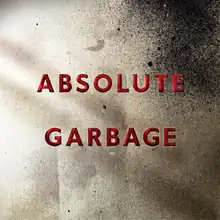 Against a metallic gray background lies in red letters the title "Absolute Garbage".