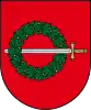 A coat of arms depicting a sword with a gold hilt and a silver blade penetrating a green wreath all on a red background