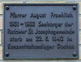 Commemorative plaque in memorial of August Froehlich, in front of St Josef's parish in Berlin-Rudow.