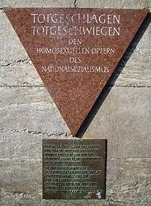 In the Berlin Nollendorfplatz subway station, a pink triangle plaque honors gay male victims.