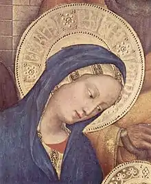 Pseudo-Arabic script in the Virgin Mary's halo, detail of Adoration of the Magi (1423) by Gentile da Fabriano. The script is further divided by rosettes like those on Mamluk dishes.