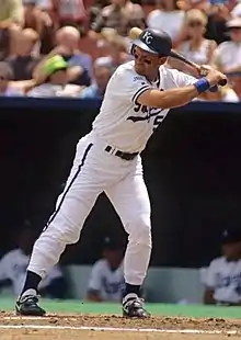 George Brett, wearing a white Kansas City Royals home jersey, prepares to bat