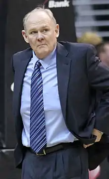 George Kart coaching a basketball team in 2011