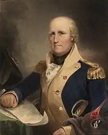 A bald man with rosy cheeks wearing a high-collared jacket