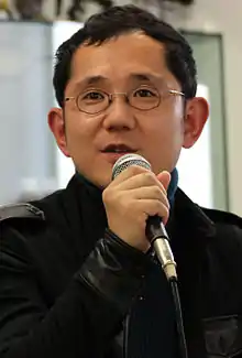 A photograph of Shu Takumi