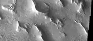 Gigas Sulci, as seen by THEMIS. Wavy linear ridges are dunes.  Dark slope streaks are visible on some slopes if you click on image for larger view.