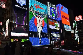 Glico Man sign (5th neon version), lit at night