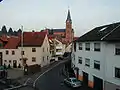 Residential street with the Catholic parish church St. Nikolaus in Goldbach