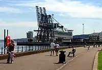 Container cranes at Greenock's Ocean Terminal, with the berth occupied by the cruise ship Golden Princess.