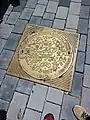 Painted gold Manhole cover in Tel Aviv, Israel