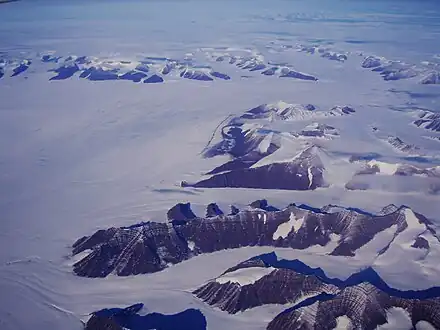 Southward bend in the Christian IV Glacier with the Gronau Nunataks in the background and the norrhwest part of the Watkins Range on the right